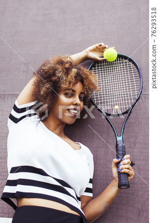 young stylish afro-american girl playing tennis, sport healthy lifestyle people concept young stylish afro-american girl playing tennis, sport healthy lifestyle people concept 76293518