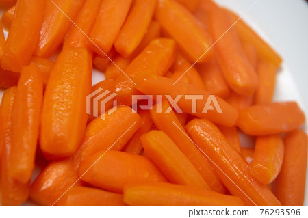 Preparing fresh carrots cooked on plate Preparing fresh carrots cooked on plate 76293596