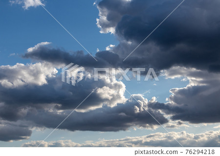 Scenic cloudy blue sky. Sunlight in cloudscape 76294218