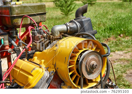 Color homemade tractor mechanism with pipes and wires Color homemade tractor mechanism with pipes and wires 76295103