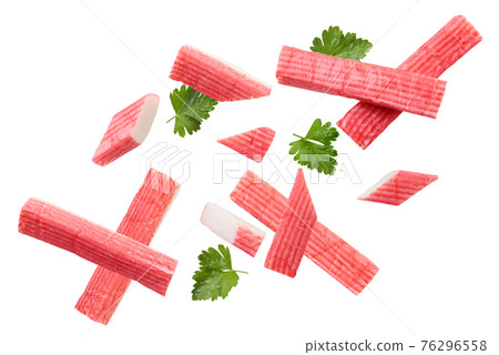 Crab sticks and parsley fly on a white background. Isolated 76296558