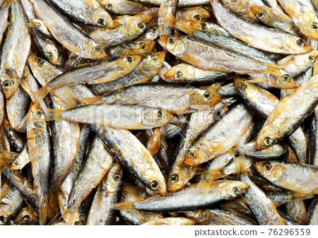 Small cold smoked fish background. The view from top Small cold smoked fish background. The view from top 76296559