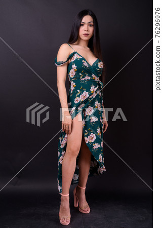 Full body shot of young beautiful Asian transgender woman 76296976