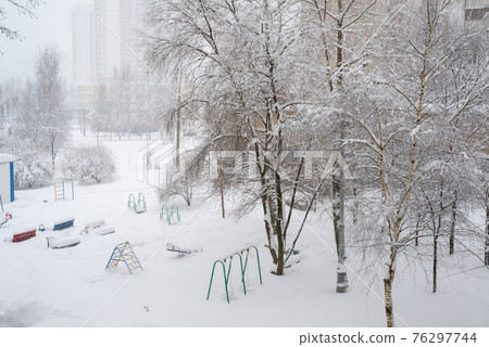 Snow-covered courtyard of multi-storey residential building in Moscow, Russia Snow-covered courtyard of multi-storey residential building in Moscow, Russia 76297744
