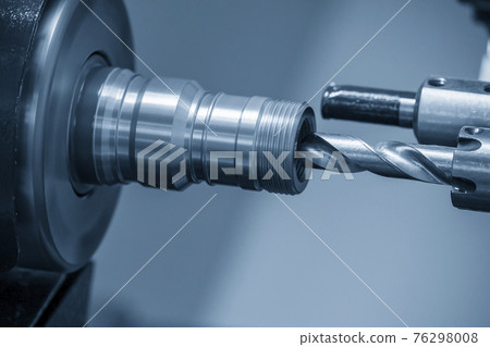 The CNC lathe machine drilling the pipe connector parts. The CNC lathe machine drilling the pipe connector parts. 76298008
