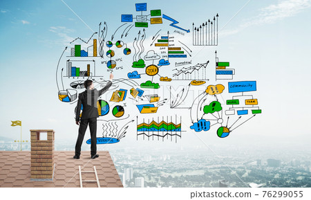 Rear view of businessman on house roof drawing his new business strategy. Mixed media Rear view of businessman on house roof drawing his new business strategy. Mixed media 76299055