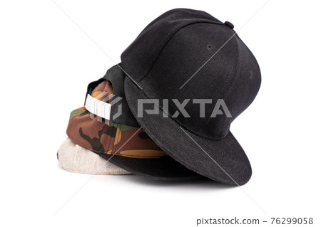 Snapback hats in different colors stacked on top of each other Snapback hats in different colors stacked on top of each other 76299058