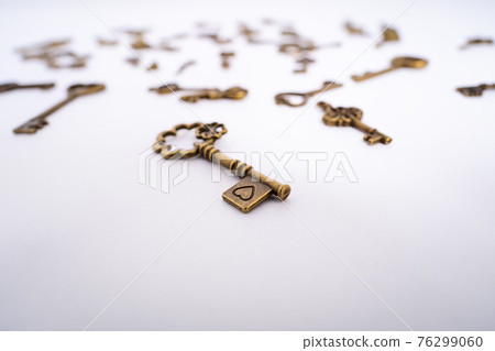Close up of vintage key with a heart engraving Close up of vintage key with a heart engraving 76299060