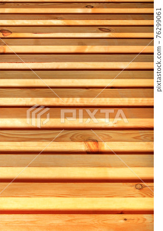 Wooden horizontal planks are located one after another, from bottom to top and going into perspective and blur. Wooden horizontal planks are located one after another, from bottom to top and going into perspective and blur. 76299061