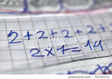 Checkered notebook with mathematical calculations of a child Checkered notebook with mathematical calculations of a child 76299318