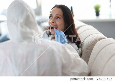 Woman is tested for coronavirus infection closeup Woman is tested for coronavirus infection closeup 76299397