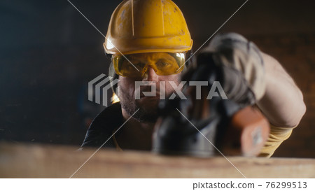 Professional carpenter shaping wooden board 76299513