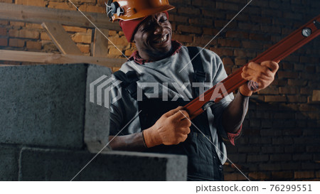 African American man singing on construction site 76299551