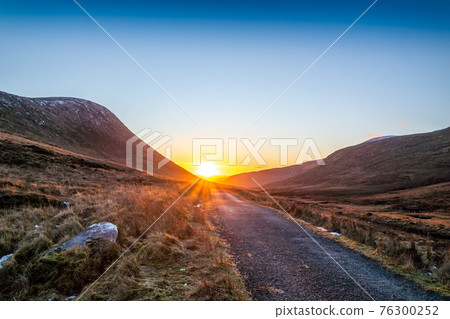 Winter sunset at the Glenveagh National Park in County Donegal - Ireland Winter sunset at the Glenveagh National Park in County Donegal - Ireland 76300252