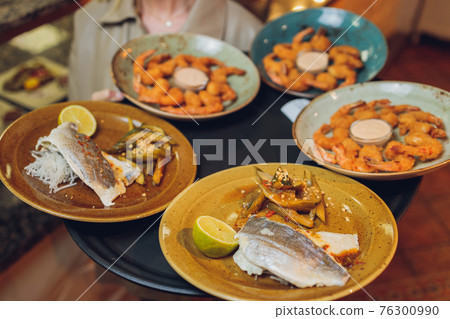 Tray with fish in a restaurant in La Restinga on the coast of the island of El Hierro in the Canary Islands. 76300990