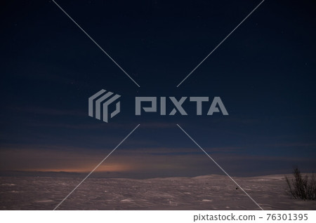 northern light on the silent field before sun rise. northern light on the silent field before sun rise. 76301395