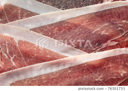 Sliced prosciutto, top view. Sliced prosciutto, top view. 76301733