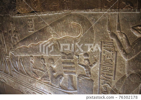 Mysterious murals on the walls of the Temple of Dendera Hathor , near the city of Ken. Electric lamps in the image 76302178