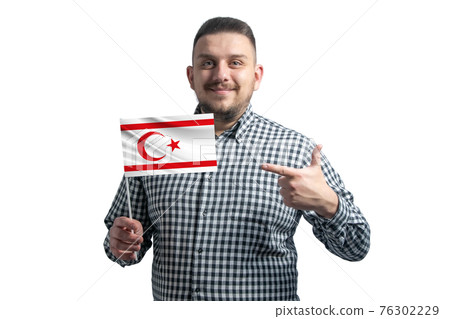 White guy holding a flag of Turkish Republic of Northern Cyprus and points the finger of the other hand at the flag isolated on a white background White guy holding a flag of Turkish Republic of Northern Cyprus and points the finger of the other hand at the flag isolated on a white background 76302229