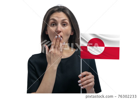 Happy young white woman holding flag of Greenland and covers her mouth with her hand isolated on a white background 76302233