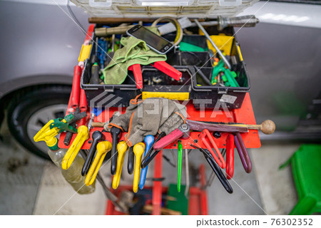 Tools for car repair without painting in the workshop isolated static. Tools for car repair without painting in the workshop isolated static. 76302352