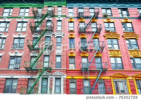 Old colorful buildings with fire escapes, New York City, USA. Old colorful buildings with fire escapes, New York City, USA. 76302789