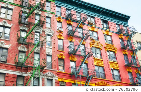 Old colorful buildings with fire escapes, New York City, USA. 76302790