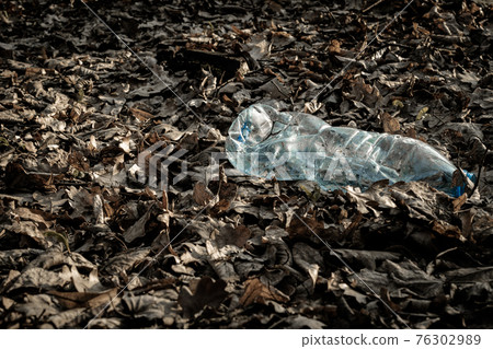 Plastic bottle. Waste garbage in forest and environment. Trash rubbish in woodland. Save nature Ecology and pollution concept. Plastic bottle. Waste garbage in forest and environment. Trash rubbish in woodland. Save nature Ecology and pollution concept. 76302989