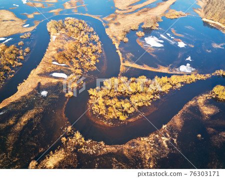Spring melting river flood aerial panorama. Overflow water at springtime. Spring melting river flood aerial panorama. Overflow water at springtime. 76303171