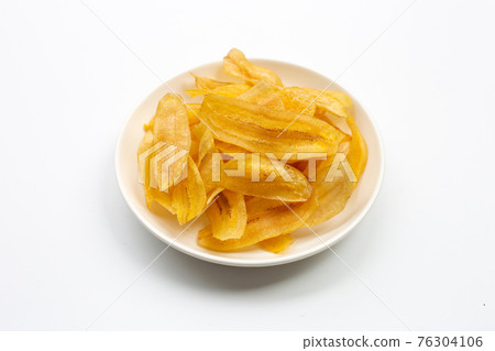 Banana slice chips on white background. Banana slice chips on white background. 76304106