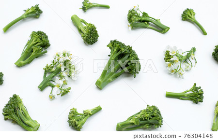 Green baby broccoli with chinese kale flower on white background. Green baby broccoli with chinese kale flower on white background. 76304148