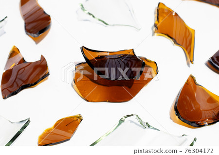 Glass shards isolated on white background. Glass shards isolated on white background. 76304172