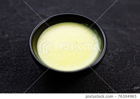 Garlic sauce dip in bowl, condiment for tasty food Garlic sauce dip in bowl, condiment for tasty food 76304965