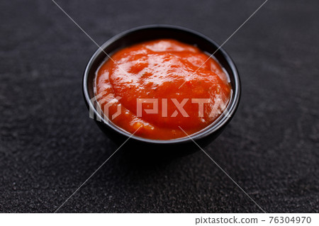Tomato barbeque sauce dip in bowl, close up Tomato barbeque sauce dip in bowl, close up 76304970