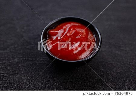 Tomato barbeque sauce dip in bowl, close up Tomato barbeque sauce dip in bowl, close up 76304973