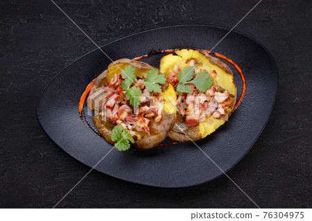 Baked whole smashed grilled potatoes with bacon Baked whole smashed grilled potatoes with bacon 76304975