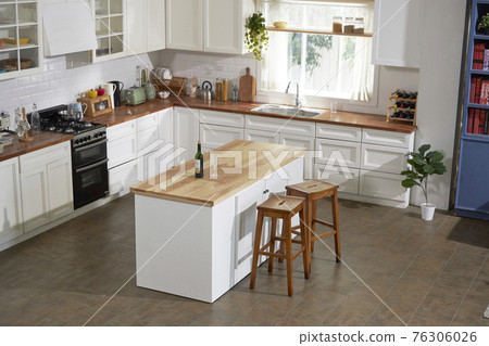 Large kitchen with island table Large kitchen with island table 76306026