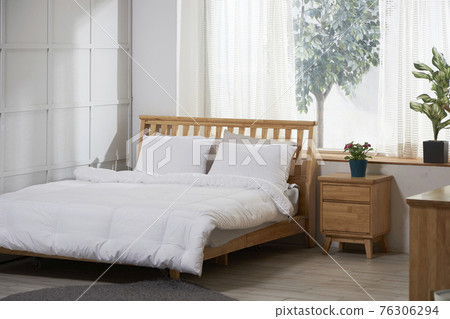 White bedroom with large window White bedroom with large window 76306294