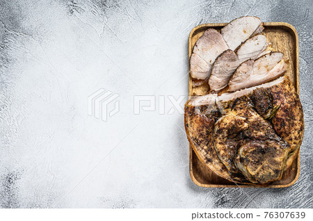 Roast sliced pork knuckle. Leg meat. Gray background. Top view. Copy space Roast sliced pork knuckle. Leg meat. Gray background. Top view. Copy space 76307639