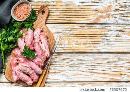 Raw Chicken neck meat, offals. White Wooden background. Top view. Copy space Raw Chicken neck meat, offals. White Wooden background. Top view. Copy space 76307673