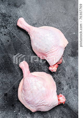 Free range raw Duck legs. Black background. Top view Free range raw Duck legs. Black background. Top view 76307769