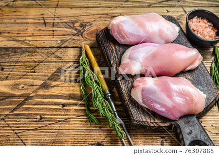 Boneless Raw Chicken thigh fillet. Wooden background. Top view. Copy space Boneless Raw Chicken thigh fillet. Wooden background. Top view. Copy space 76307888