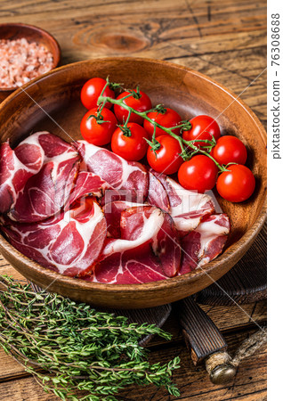 Italian sliced cured coppa ham with spices. wooden background. Top view 76308688