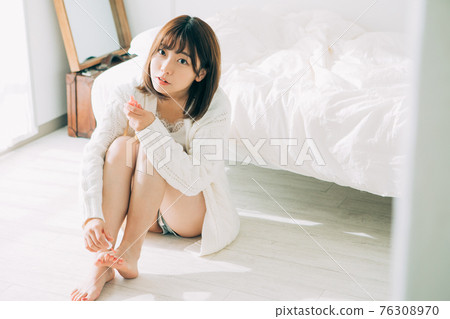 A woman with a pedicure 76308970