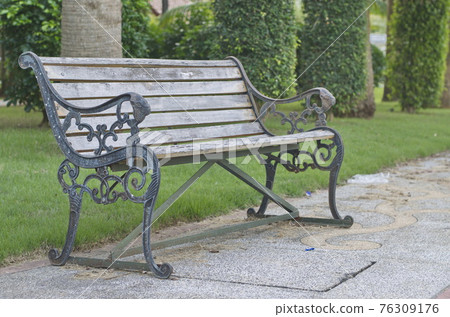Wooden chair for relaxing in the garden. 76309176