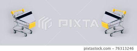 Sale banner with yellow shopping cart with credit card inside on light gray background with copy space. Sale event, Black Friday and Cyber Monday concept in colors of the year 2021. Selective focus Sale banner with yellow shopping cart with credit card inside on light gray background with copy space. Sale event, Black Friday and Cyber Monday concept in colors of the year 2021. Selective focus 76313246