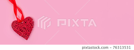 Banner with red heart, as a symbol of love, on pink background with copy space for your text - St. Valentine's Day celebration concept. Love backdrop for greeting card, selective focus Banner with red heart, as a symbol of love, on pink background with copy space for your text - St. Valentine's Day celebration concept. Love backdrop for greeting card, selective focus 76313531