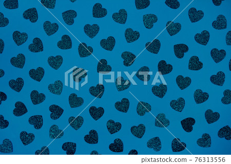 Festive blue background with glitter hearts - St. Valentine's Day celebration concept. Love backdrop for greeting card, copy space for your text, selective focus. Toned image Festive blue background with glitter hearts - St. Valentine's Day celebration concept. Love backdrop for greeting card, copy space for your text, selective focus. Toned image 76313556