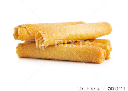 Sweet waffle tubes rolls isolated on white background. Sweet waffle tubes rolls isolated on white background. 76314424