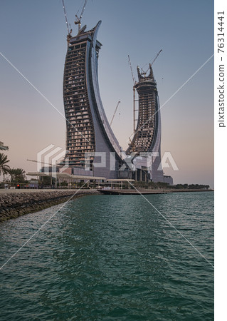 Katara Towers project in Lusail marina in Lusail city, Qatar daylight view .Construction industry concept. 76314441